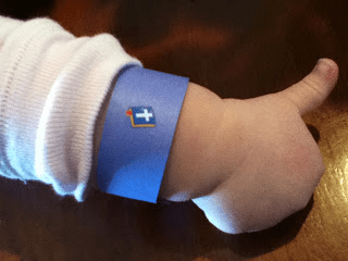 child wearing a blue bracelet to remind children to obey God