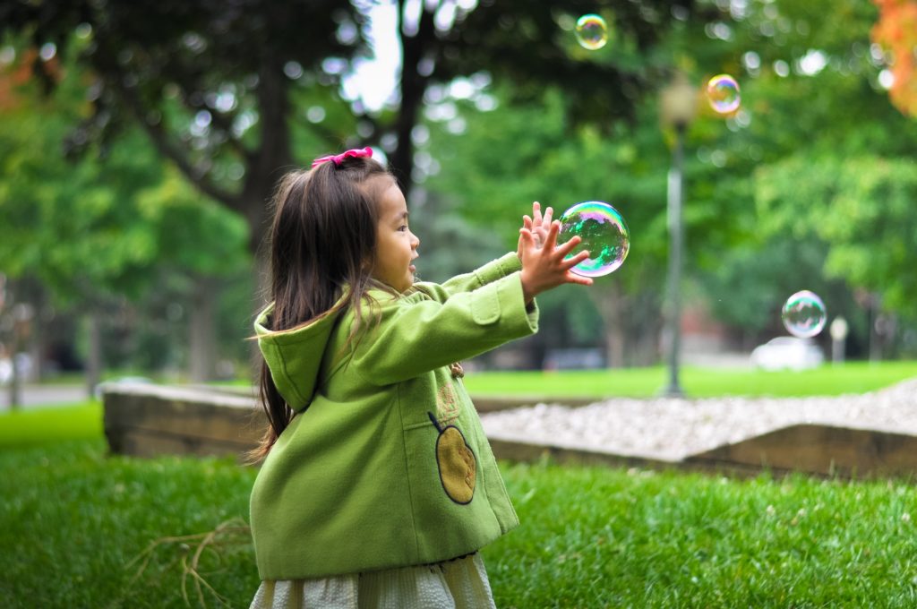preschool devotion about God giving us life. child catching bubbles